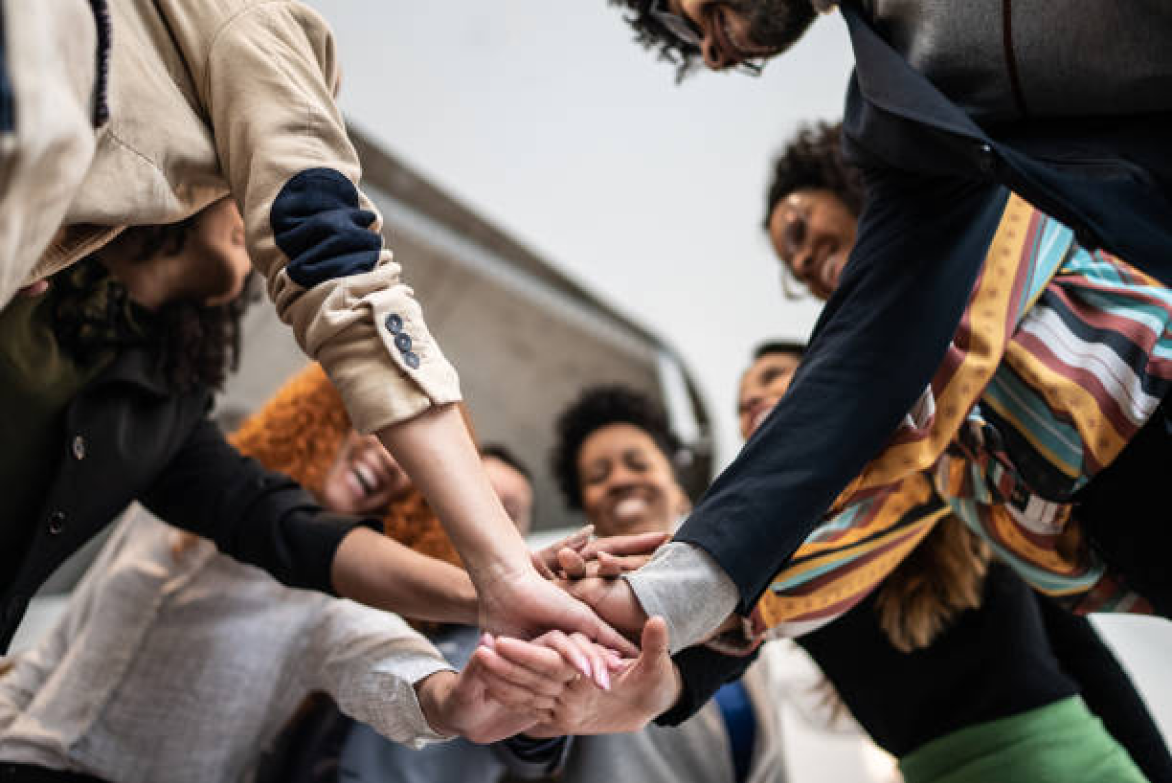 People putting their hands together
